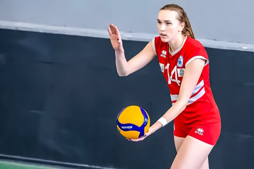 Volleyball professional Kseniya Pugach serving